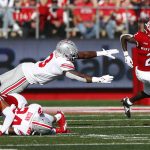 
              Rutgers wide receiver Aron Cruickshank (2) runs away from Ohio State linebacker Teradja Mitchell (3)  during an NCAA college football game, Saturday, Oct. 2, 2021, in Piscataway, N.J. (AP Photo/Noah K. Murray)
            