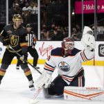 
              Edmonton Oilers goaltender Mikko Koskinen (19) makes a glove-save as Vegas Golden Knights right wing Evgenii Dadonov (63) looks on during the second period of an NHL hockey game Friday, Oct. 22, 2021, in Las Vegas. (AP Photo/Steve Marcus)
            