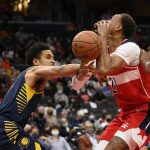 
              Washington Wizards center Daniel Gafford (21) loses the ball as Indiana Pacers guard Malcolm Brogdon, left, defends during the first half of an NBA basketball game Friday, Oct. 22, 2021, in Washington. (AP Photo/Nick Wass)
            
