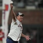 
              Former Atlanta Braves pitcher Greg Maddux throws out the ceremonial first pitch before Game 5 of baseball's World Series between the Houston Astros and the Atlanta Braves Sunday, Oct. 31, 2021, in Atlanta. (AP Photo/David J. Phillip)
            