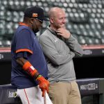 
              Houston Astros manager Dusty Baker, left, smiles as he talks with general manager James Click, right, during baseball practice in Houston, Thursday, Oct. 14, 2021. The Astros host the Boston Red Sox in Game 1 of the American League Championship Series on Friday. (AP Photo/Tony Gutierrez)
            