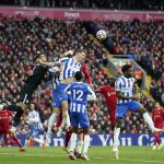 
              Brighton's goalkeeper Robert Sanchez punches the ball away during the English Premier League soccer match between Liverpool and Brighton and Hove Albion at Anfield Stadium, Liverpool, England, Saturday, Oct. 30, 2021. (AP Photo/Jon Super)
            