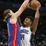 
              Orlando Magic center Wendell Carter Jr. (34) goes to the basket against Detroit Pistons forward Kelly Olynyk during the first half of an NBA basketball game Saturday, Oct. 30, 2021, in Detroit. (AP Photo/Duane Burleson)
            