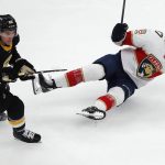
              Boston Bruins' Erik Haula (56) checks Florida Panthers' Mason Marchment (17) during the second period of an NHL hockey game, Saturday, Oct. 30, 2021, in Boston. (AP Photo/Michael Dwyer)
            