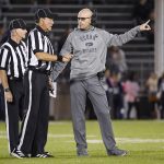 
              Connecticut interim head coach Lou Spanos, right, speaks with officials in the first half of an NCAA college football game against Middle Tennessee State, Friday, Oct. 22, 2021, in East Hartford, Conn. (Jessica Hill/Hartford Courant via AP)
            