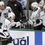 
              Los Angeles Kings center Gabriel Vilardi (13) fist-bumps Anze Kopitar (11) after scoring a goal against the Dallas Stars during the second period of an NHL hockey game Friday, Oct. 22, 2021, in Dallas. (AP Photo/Richard W. Rodriguez)
            