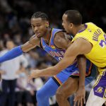 
              Oklahoma City Thunder guard Shai Gilgeous-Alexander (2) goes against Los Angeles Lakers guard Avery Bradley (20) during the second half of an NBA basketball game, Wednesday, Oct. 27, 2021, in Oklahoma City. (AP Photo/Garett Fisbeck)
            