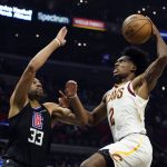 
              Cleveland Cavaliers guard Collin Sexton (2) goes up for a dunk over Los Angeles Clippers forward Nicolas Batum (33) during the first half of an NBA basketball game Wednesday, Oct. 27, 2021, in Los Angeles. (AP Photo/Marcio Jose Sanchez)
            