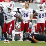 
              Louisiana Tech's Smoke Harris (6) breaks away from North Carolina State's Tanner Ingle (10) during the first half of an NCAA college football game in Raleigh, N.C., Saturday, Oct. 2, 2021. (AP Photo/Karl B DeBlaker)
            