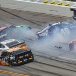 
              Ross Chastain (42) and Alex Bowman (48) get sideways during a NASCAR Cup series auto race Monday, Oct. 4, 2021, in Talladega, Ala. (AP Photo/Greg McWilliams)
            