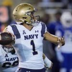 
              Navy quarterback Tai Lavatai (1) throws in the first half of an NCAA college football game against Tulsa, Friday, Oct. 29, 2021, in Tulsa, Okla. (AP Photo/Sue Ogrocki)
            