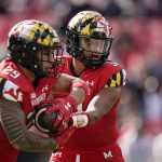 
              Maryland quarterback Taulia Tagovailoa, right, hands off to running back Challen Faamatau during the first half of an NCAA college football game against Indiana, Saturday, Oct. 30, 2021, in College Park, Md. (AP Photo/Julio Cortez)
            