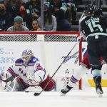 
              New York Rangers goaltender Igor Shesterkin (31) makes a save against a shot from Seattle Kraken center Riley Sheahan (15) during the first period of an NHL hockey game, Sunday, Oct. 31, 2021, in Seattle. (AP Photo/Lindsey Wasson)
            