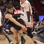 
              Miami Heat guard Tyler Herro (14) and Orlando Magic guard R.J. Hampton (13) go after a loose ball during the first half of an NBA basketball game, Monday, Oct. 25, 2021, in Miami. (AP Photo/Marta Lavandier)
            