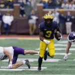 
              Michigan wide receiver A.J. Henning (3) rushes through the Northwestern defensive line during the first half of an NCAA college football game, Saturday, Oct. 23, 2021, in Ann Arbor, Mich. (AP Photo/Carlos Osorio)
            