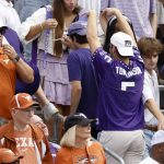 
              A TCU fan gestures toward Texas fans during the first half of an NCAA college football game Saturday, Oct. 2, 2021, in Fort Worth, Texas. (AP Photo/Ron Jenkins)
            