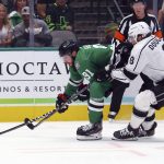 
              Dallas Stars center Tyler Seguin (91) and Los Angeles Kings defenseman Drew Doughty (8) battle for the puck during the first period of an NHL hockey game Friday, Oct. 22, 2021, in Dallas. (AP Photo/Richard W. Rodriguez)
            