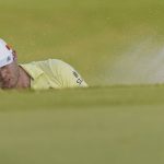 
              Sam Burns hits out of a sand bunker near the 18th hole during the final day of the Sanderson Farms Championship golf tournament in Jackson, Miss., Sunday, Oct. 3, 2021. (AP Photo/Rogelio V. Solis)
            