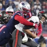 
              Tampa Bay Buccaneers quarterback Tom Brady, right, is sacked by New England Patriots outside linebacker Matt Judon, left, during the first half of an NFL football game, Sunday, Oct. 3, 2021, in Foxborough, Mass. (AP Photo/Elise Amendola)
            