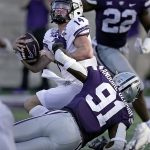 
              TCU quarterback Chandler Morris (14) is sacked by Kansas State defensive end Felix Anudike-Uzomah (91) during the second half of an NCAA college football game, Saturday, Oct. 30, 2021, in Manhattan, Kan. (AP Photo/Charlie Riedel)
            
