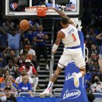 
              New York Knicks' Obi Toppin (1) makes an uncontested dunk after picking up a loose ball from an Orlando Magic turnover during the second half of an NBA basketball game Friday, Oct. 22, 2021, in Orlando, Fla. (AP Photo/John Raoux)
            