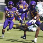
              East Carolina's Keaton Mitchell runs the ball against Tulane during an NCAA college football game, Saturday, Oct. 2, 2021 at Dowdy-Ficklen Stadium in Greenville, N.C. (Scott Davis/The Daily Reflector via AP)
            