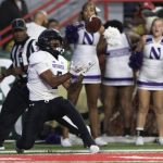 
              Northwestern's Stephon Robinson (5) catches a touchdown pass against Nebraska during the first half of an NCAA college football game Saturday, Oct. 2, 2021, at Memorial Stadium in Lincoln, Neb. (AP Photo/Rebecca S. Gratz)
            