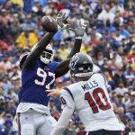
              Buffalo Bills defensive end Mario Addison (97) tips a pass by Houston Texans quarterback Davis Mills (10) during the first half of an NFL football game, Sunday, Oct. 3, 2021, in Orchard Park, N.Y. (AP Photo/Adrian Kraus)
            