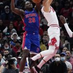 
              Detroit Pistons center Isaiah Stewart, left, blocks a shot by Chicago Bulls guard Zach LaVine during the first half of an NBA basketball game in Chicago, Saturday, Oct. 23, 2021. (AP Photo/Nam Y. Huh)
            