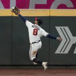 
              Atlanta Braves left fielder Eddie Rosario catches a fly ball hit by Houston Astros' Jose Altuve during the eighth inning in Game 4 of baseball's World Series between the Houston Astros and the Atlanta Braves Saturday, Oct. 30, 2021, in Atlanta. (AP Photo/Brynn Anderson)
            