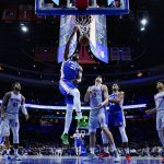 
              Philadelphia 76ers' Joel Embiid (21) dunks past Detroit Pistons' Luka Garza (55) during the first half of an NBA basketball game, Thursday, Oct. 28, 2021, in Philadelphia. (AP Photo/Matt Slocum)
            