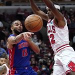 
              Detroit Pistons guard Cory Joseph, left, passes the ball as Chicago Bulls forward Alize Johnson guards during the first half of an NBA basketball game in Chicago, Saturday, Oct. 23, 2021. (AP Photo/Nam Y. Huh)
            
