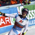 
              Switzerland's Marco Odermatt celebrates after crossing the finish line during an alpine ski, men's World Cup giant slalom, in Soelden, Austria, Sunday, Oct. 24, 2021. (AP Photo/Marco Trovati)
            