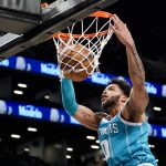 
              Charlotte Hornets forward Miles Bridges dunks during the first half of an NBA basketball game against the Brooklyn Nets, Sunday, Oct. 24, 2021, in New York. (AP Photo/John Minchillo)
            