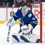 
              Vancouver Canucks goalie Thatcher Demko makes a save against the Edmonton Oilers during the first period of an NHL hockey game Saturday, Oct. 30, 2021, in Vancouver, British Columbia. (Rich Lam/The Canadian Press via AP)
            