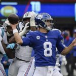 
              New York Giants quarterback Daniel Jones (8) throws a pass during the first half of an NFL football game against the Carolina Panthers, Sunday, Oct. 24, 2021, in East Rutherford, N.J. (AP Photo/Bill Kostroun)
            