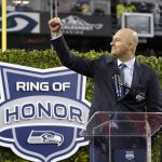 
              Former Seattle Seahawks quarterback Matt Hasselbeck motions after being introduced as one of the team's newest members of the team's "Ring of Honor" during halftime of an NFL football game against the New Orleans Saints, Monday, Oct. 25, 2021, in Seattle. (AP Photo/Ted S. Warren)
            