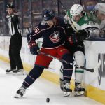 
              Columbus Blue Jackets' Dean Kukan, left, checks Dallas Stars' Miro Heiskanen away from the puck during the first period of an NHL hockey game Monday, Oct. 25, 2021, in Columbus, Ohio. (AP Photo/Jay LaPrete)
            