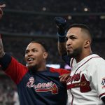 
              Atlanta Braves' Eddie Rosario, right, celebrates after hitting a three run home run during the fourth inning in Game 6 of baseball's National League Championship Series against the Los Angeles Dodgers Saturday, Oct. 23, 2021, in Atlanta.(AP Photo/Ashley Landis)
            