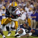 
              LSU wide receiver Kayshon Boutte (1) carries as he is tackled by Auburn safety Zion Puckett in the first half of an NCAA college football game in Baton Rouge, La., Saturday, Oct. 2, 2021. (AP Photo/Gerald Herbert)
            