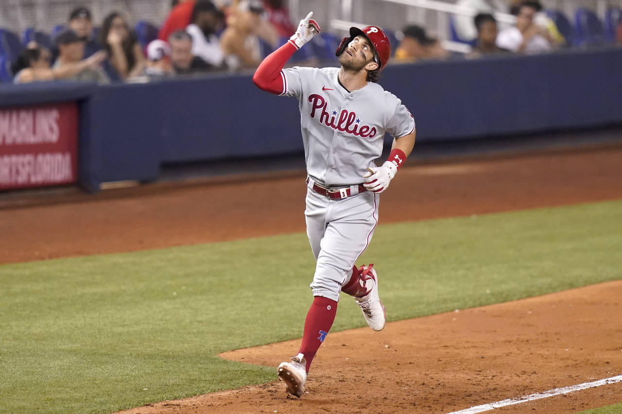 Philadelphia Phillies' Bryce Harper rounds the bases after hitting a solo home run during the fifth...