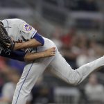 
              New York Mets pitcher Edwin Diaz works against the Atlanta Braves in the ninth inning of a baseball game Friday, Oct. 1, 2021, in Atlanta. (AP Photo/Ben Margot)
            