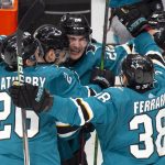 
              San Jose Sharks right wing Timo Meier, center, is mobbed by his teammates after his overtime goal against the Winnipeg Jets in an NHL hockey game, Saturday, Oct. 30, 2021, in San Jose, Calif. The Sharks won 2-1. (AP Photo/D. Ross Cameron)
            