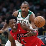 
              Toronto Raptors' OG Anunoby (3) loses control of the ball in front of Boston Celtics' Al Horford during the first half of an NBA basketball game, Friday, Oct. 22, 2021, in Boston. (AP Photo/Michael Dwyer)
            