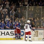 
              New York Rangers left wing Alexis Lafreniere, second from left, reacts after scoring a goal against Columbus Blue Jackets goaltender Elvis Merzlikins during the first period of an NHL hockey game Friday, Oct. 29, 2021, in New York. (AP Photo/Adam Hunger)
            
