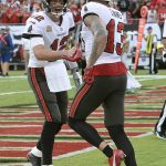 
              Tampa Bay Buccaneers quarterback Tom Brady (12) congratulates wide receiver Mike Evans (13) after Evans caught Brady's 600th career touchdown pass during the first half of an NFL football game Sunday, Oct. 24, 2021, in Tampa, Fla. (AP Photo/Jason Behnken)
            