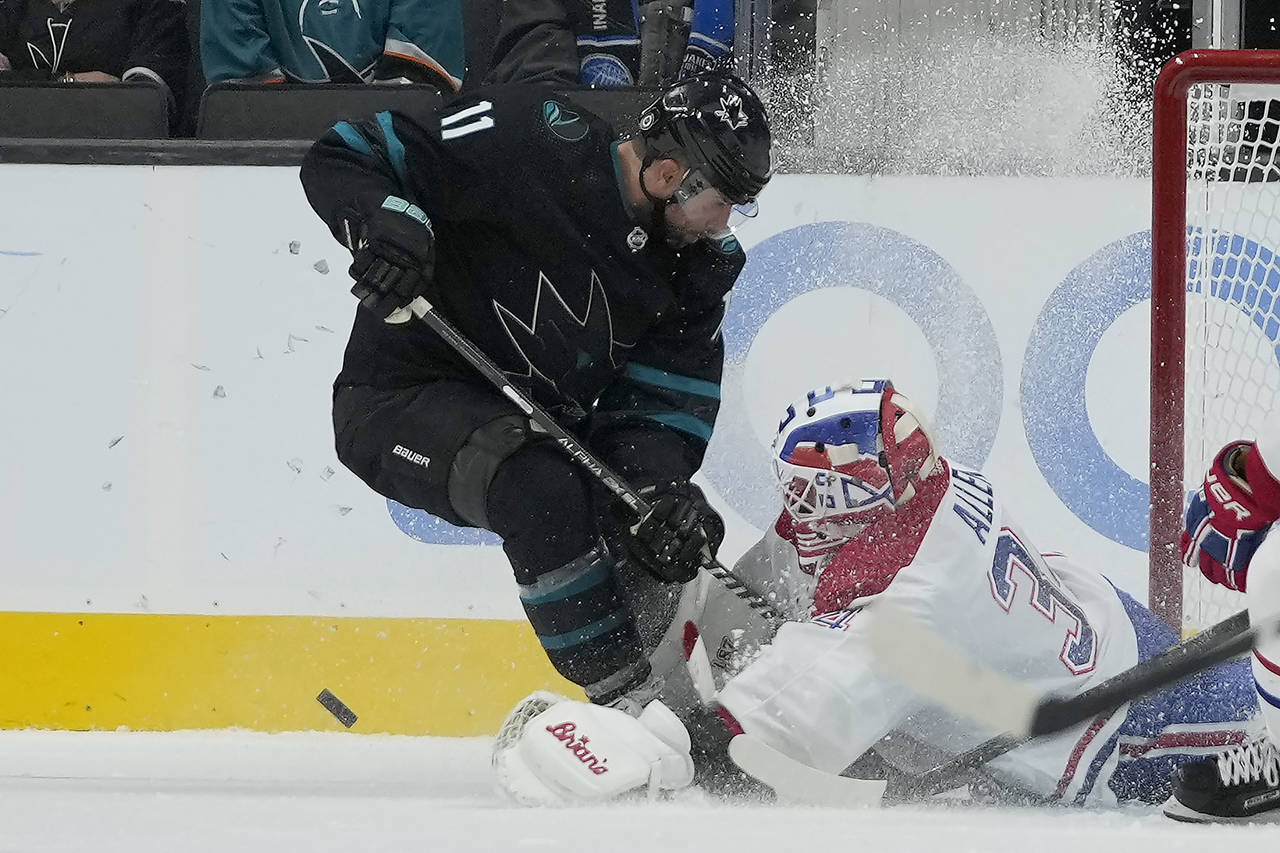 Montreal Canadiens goaltender Jake Allen (34) blocks a shot against the San Jose Sharks center Andr...