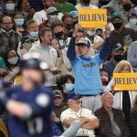 
              Seattle Mariners' fans hold up signs reading "Believe" as Mariners' Mitch Haniger comes to bat in the sixth inning of a baseball game Saturday, Oct. 2, 2021, in Seattle. (AP Photo/Elaine Thompson)
            