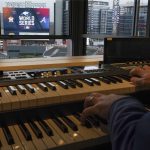 
              Atlanta Braves' organist Matthew Kaminski plays an organ overlooking Truist Field before Game 4 of baseball's World Series between the Houston Astros and the Atlanta Braves Saturday, Oct. 30, 2021, in Atlanta. Kaminski, the organist since the start of the 2009 season, has performed at more than 1,000 games and become a bit of a cult figure with the witty selections that he plays as walk-up music for opposing players. (AP Photo/Brynn Anderson)
            