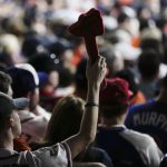 
              An Atlanta Braves fan does the chop cheer during the sixth inning in Game 2 of baseball's World Series between the Houston Astros and the Braves on Wednesday, Oct. 27, 2021, in Houston. (AP Photo/Ashley Landis)
            